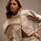 RŪH 02 Sculpted Jacket with contoured paneling, high neckline, and softly exaggerated sleeves