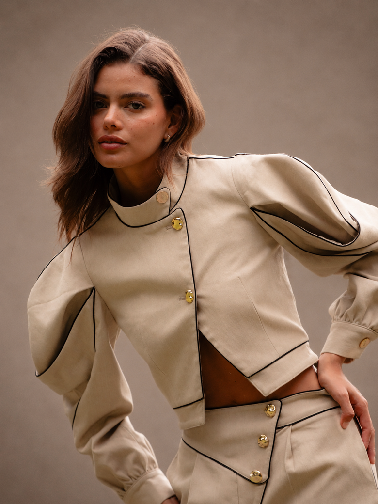 RŪH 02 Sculpted Jacket with contoured paneling, high neckline, and softly exaggerated sleeves