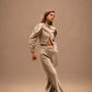 RŪH 02 Asymmetric Trousers with gold-tone button detail at the waist