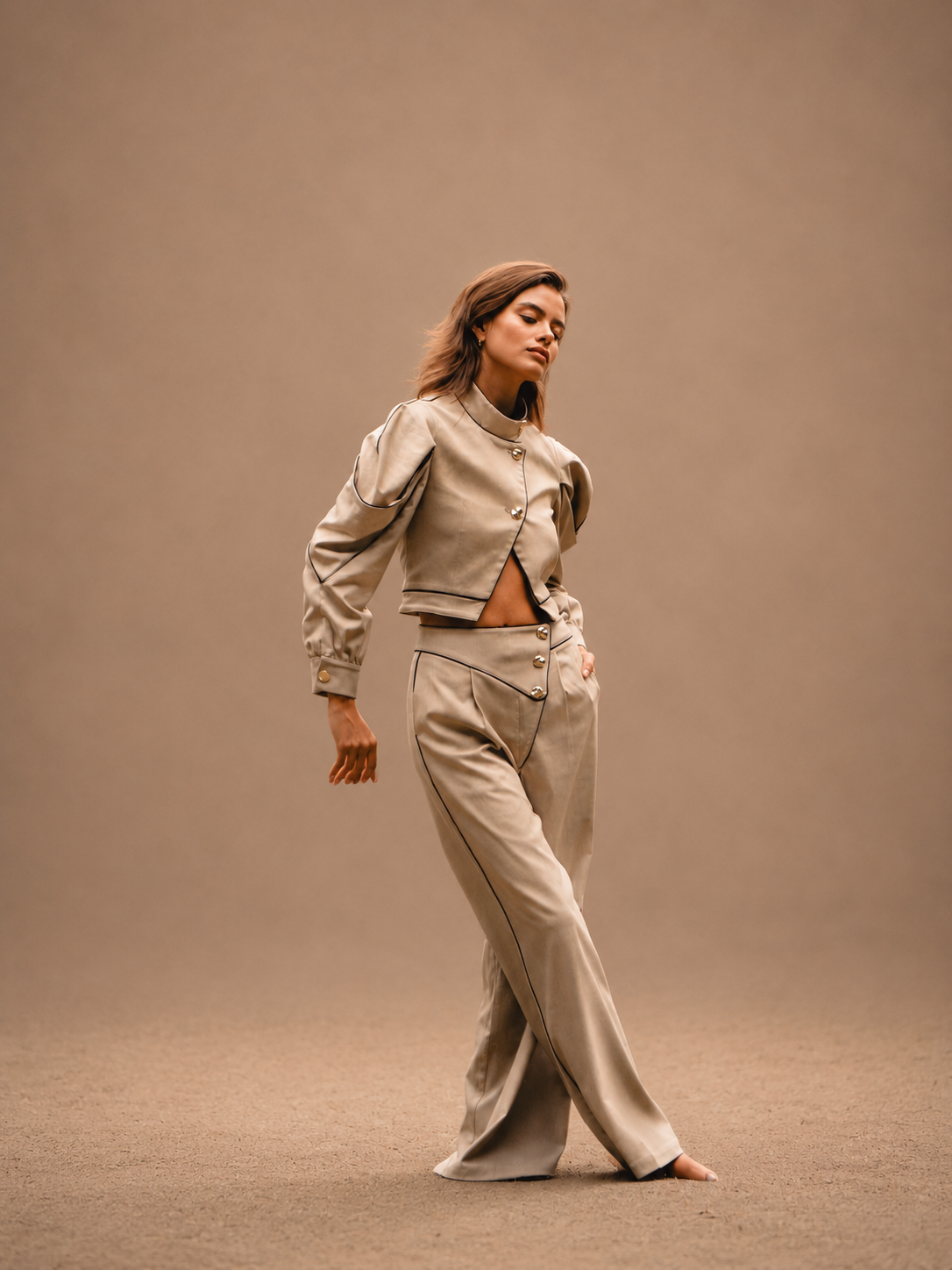 RŪH 02 Asymmetric Trousers with gold-tone button detail at the waist