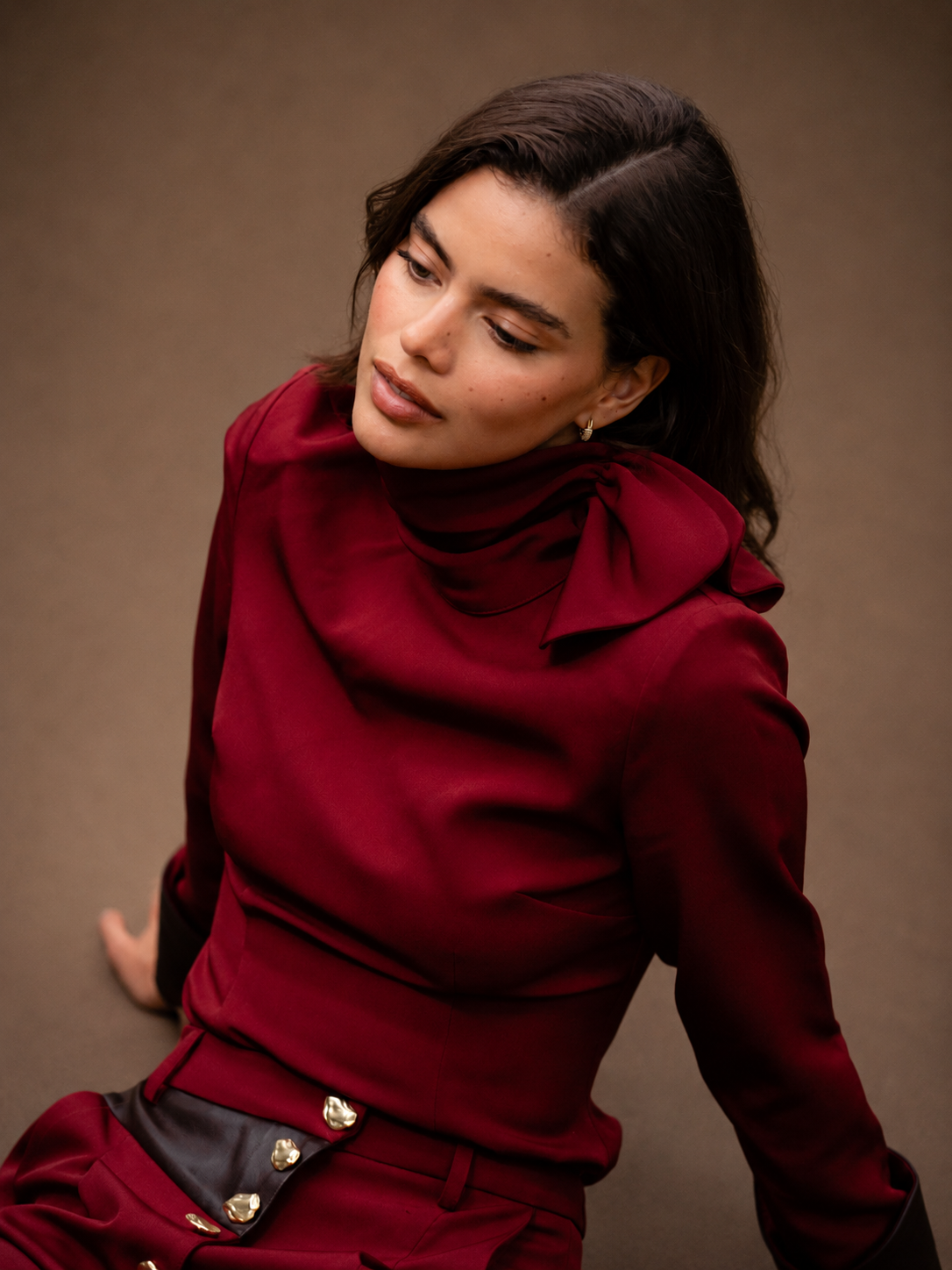 RŪH 04 Leather Top in burgundy with high neckline and asymmetric gathered shoulder
