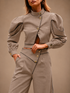 RŪH 02 Asymmetric Trousers in a tailored editorial portrait